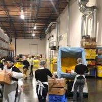 Volunteers sorting boxes at Food Lifeline in Seattle.